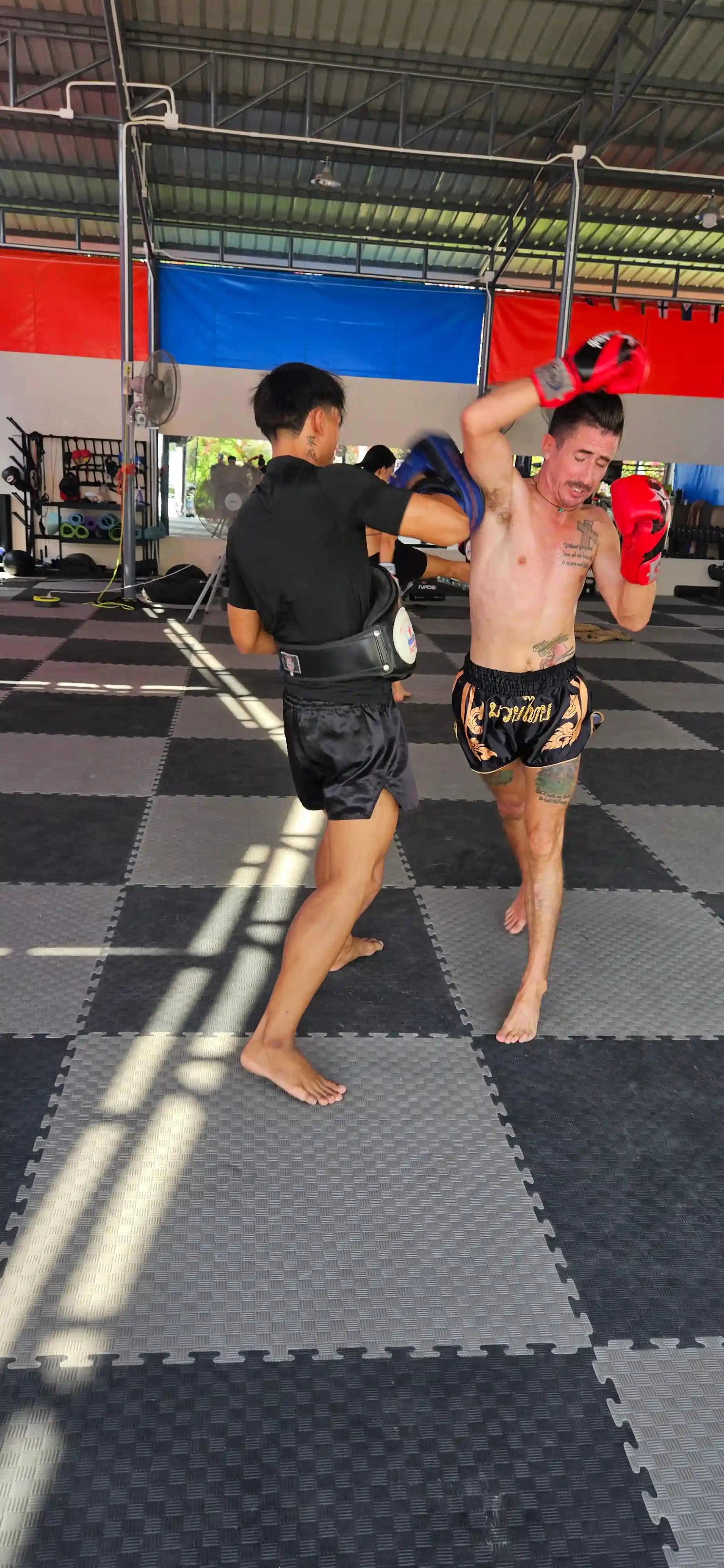 Black Gold Muay Thai shorts rear view – bold gold trim and premium stitching – order authentic fight shorts Thailand

