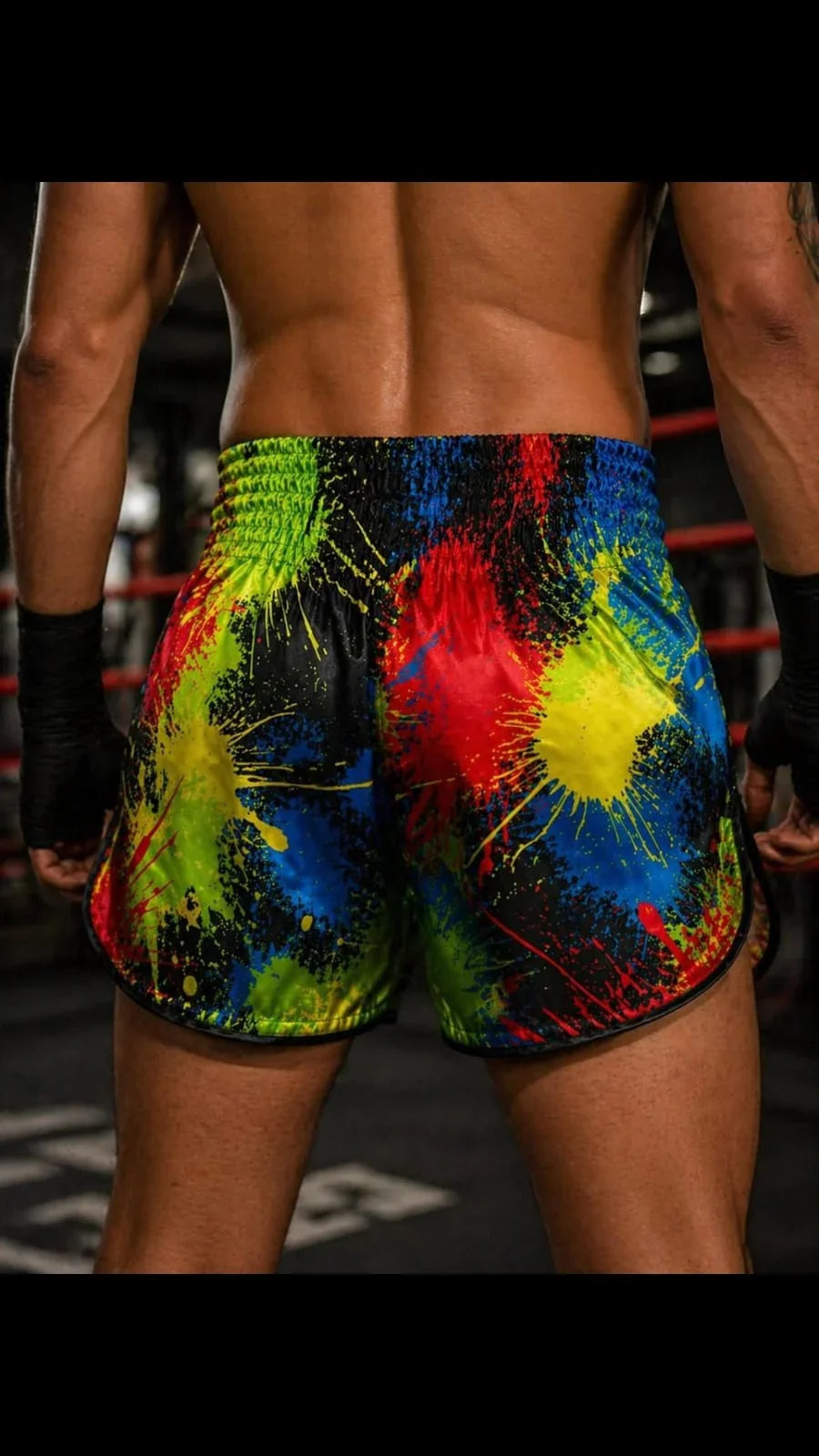 Chaos Splash Muay Thai shorts – fighter in explosive dynamic kick action shot – order premium abstract print fight shorts Thailand
