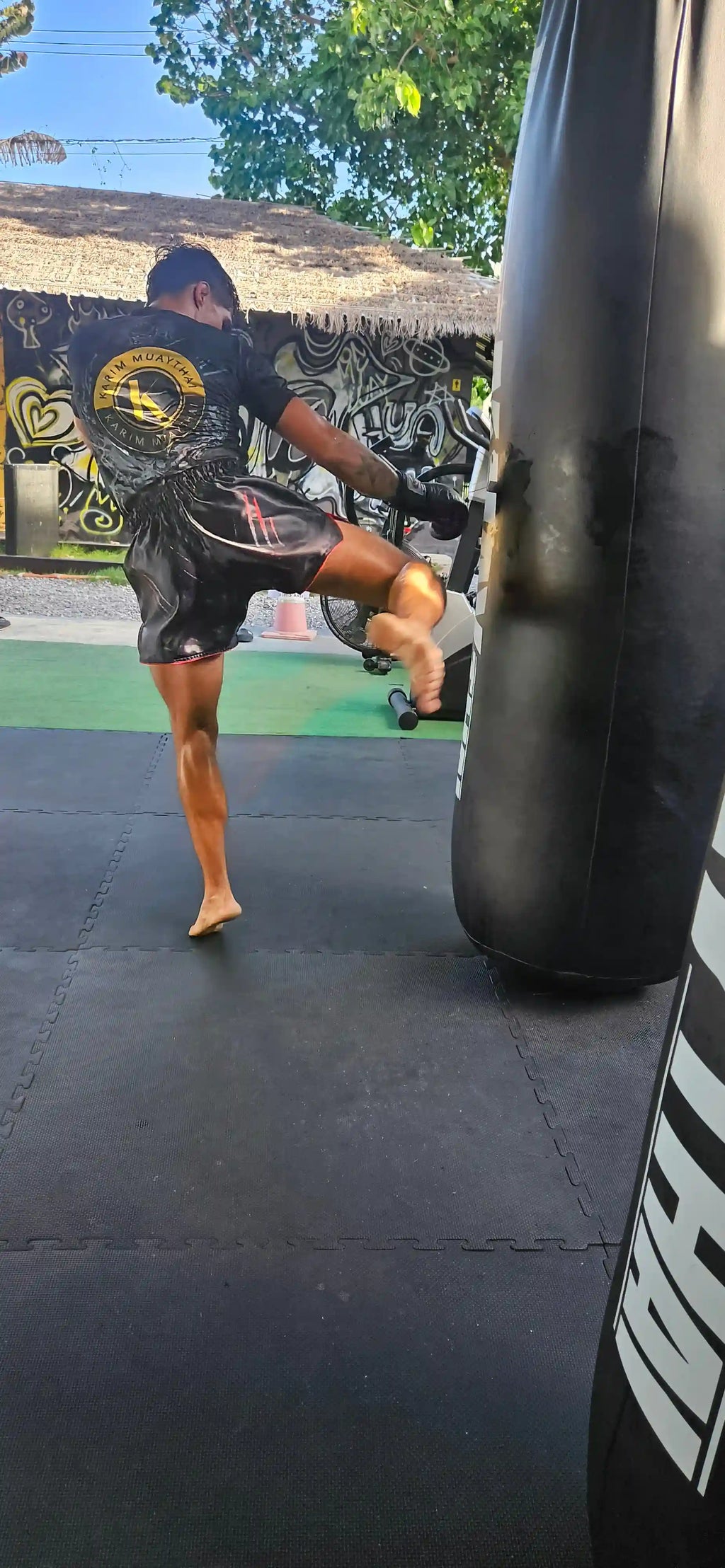 Shadow Predator Muay Thai shorts close-up – premium waistband with dark predator detail – shop authentic fight wear Thailand
